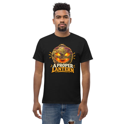 Black unisex T-shirt with a glowing carved turnip lantern and A Proper Lantern lettering, front view, worn by a model