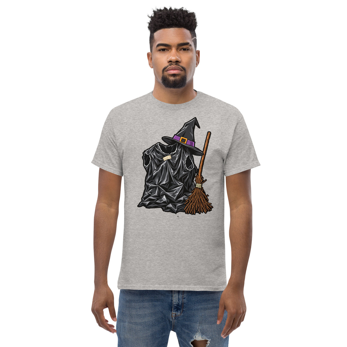 Sport Grey unisex T-shirt with a black bin-liner witch costume, pointed hat with purple band and broom, worn by a model, front view